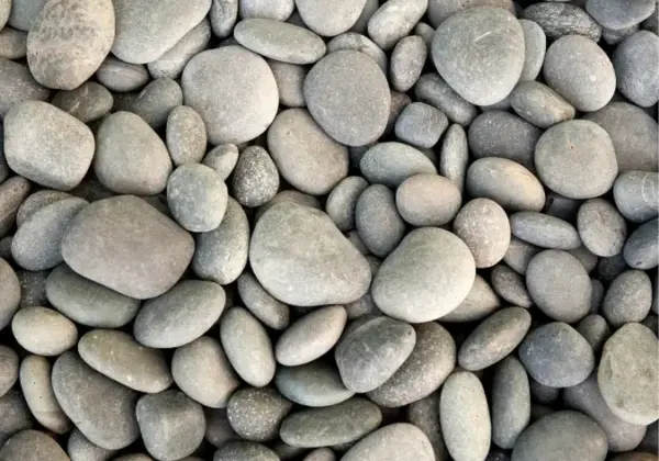 Close-up of smooth rounded gray river rock in various sizes